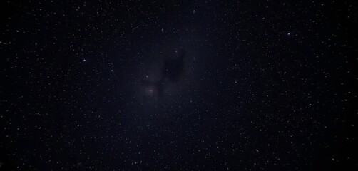 Fototapeta premium Starry night sky, celestial dust swirling across inky blackness, astronomy, deep space