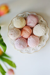 Airy Russian marshmallow dessert zephyr. Meringue dessert on a white plate, copy space