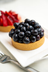 Close up of French Blackberry and Strawberry Tarts