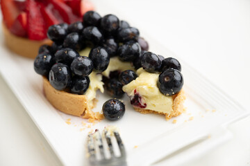 Close up of French Blackberry and Strawberry Tarts