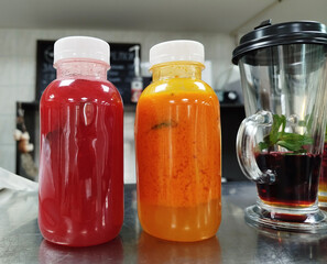 Refreshing fruit beverages prepared in a vibrant kitchen setting