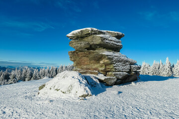 Unique massive rock formation Teufelstein in Fischbach Alps in Styria, Austria. Landscape covered...