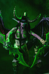 Demon Hunter Demon Cosplay on Black Background in Green Light