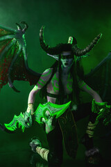 Demon Hunter Demon Cosplay on Black Background in Green Light
