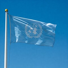 The United Nations - UN flag waving in the wind against a blue sky background	
