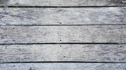Old wood surface peeling and decaying over time, garden balcony floor, horizontal wooden planks, texture image.
