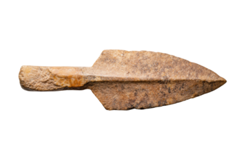 Ancient stone arrowhead artifact isolated on black background, cut out