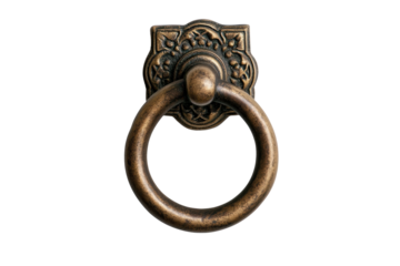 Antique brass door knocker with ornate design on black background, cut out