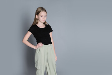 With hands on her hips, she portrays a stance of strength. Reflecting the boldness and...