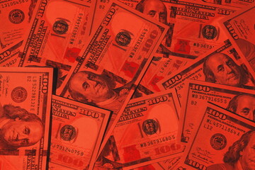 A Vibrant Red Overlay Aesthetically Showcasing U.S. Dollar Bills That Captivates the Eye