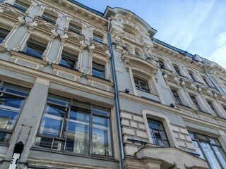 historical pink building with multiple floors, adorned with decorative features and air...