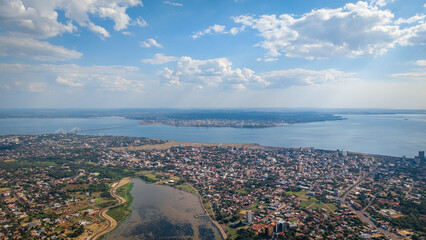 Aerial view of Encarnación city, Paraguay, with the Paraná River and Posadas city, Argentina in the background.