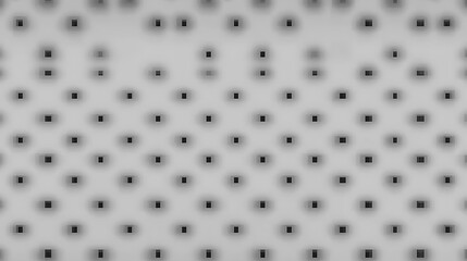 Gray surface with a pattern of dark, blurry squares arranged in a uniform grid