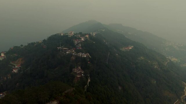 Aerial, drone shot 4k. Aerial view of the foggy day in Pelling, Sikkim. Northern India. Indian Mountain. D Log. Bird eye View. Travelling Northeast Video. Indian mountain village. IN front of Skywalk.