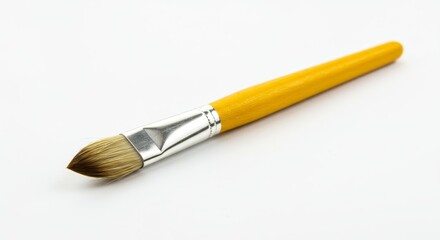 Fototapeta premium Wooden Handle Paintbrush with Silver Ferrule - Artist's paintbrush, wooden handle, yellow color, silver ferrule, fine tip. Symbolizing creativity, artistry, precision, detail, and expression
