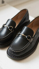 Stylish black loafers with silver accents perfect for various occasions and outfits