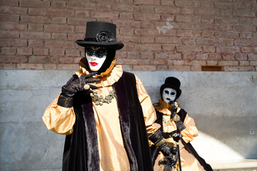 Venice, Italy - People dressed in carnival masks are photographed by tourists in the scenery of the...