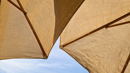 Summer umbrellas on the beach under the sun