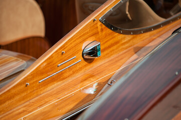classic wooden boat with polished details and chrome accents.