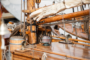 close-up of wooden sailing boat rigging and deck.
