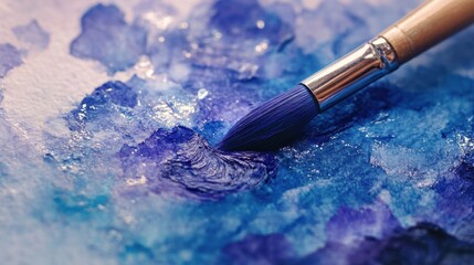 Close Up of Paintbrush on Blue Watercolor Painting