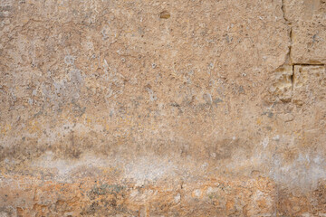 Processed collage of ancient yellow block wall texture. Background for banner, backdrop or texture for 3D mapping.A rectangular slab of light sandstone against the background of stone fragments as the