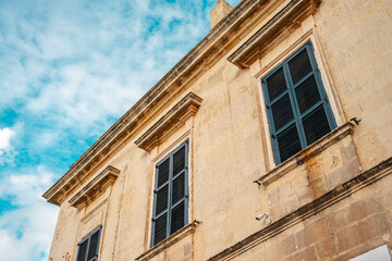 Mdina corte capitanale. ypical narrow streets with colorful balconies in VallettaTypical narrow streets with colorful balconies. Narrow streets with colourful window boxes in Valetta, MaltaTraditional