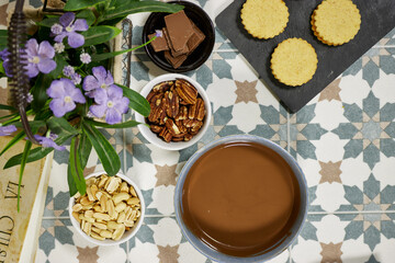 Flat Lay of Baking Ingredients and Cookies on Patterned Table Surface