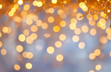 Captivating golden bokeh lights creating a festive and warm ambiance in a blurred abstract setting