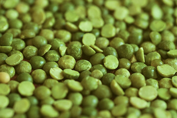 Dried and split green peas on a surface. Top view. food background. raw dried green split peas
