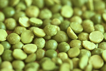 Dried and split green peas on a surface. Top view. food background. raw dried green split peas
