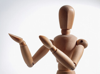 wooden man holding a mannequin