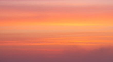 Soft, blurred sunset sky background with pastel colors, perfect for serene, calming, and peaceful designs.
