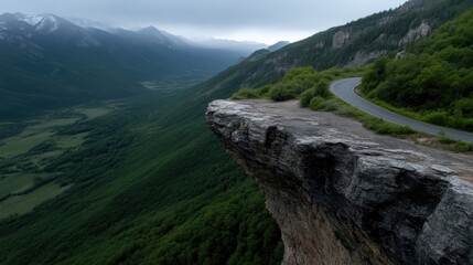 Fototapeta premium Dramatic mountain cliff overlooking a valley
