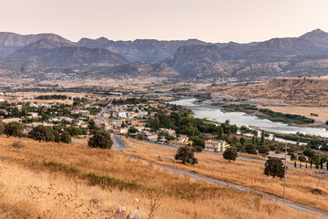 Fototapeta premium Sunset view of Rezan village in Great Zab river valley, Kurdistan Region of Iraq