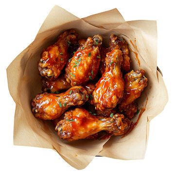 Top view Delicious grilled and roasted chicken wings, a savory poultry meal on paper basket against a  transparent background.