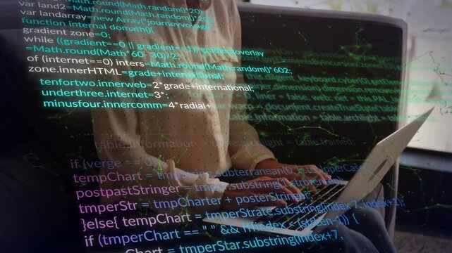 Working on laptop, person viewing animation of computer code in office environment