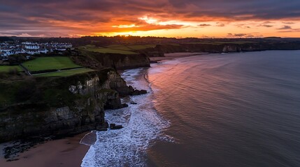 Obraz premium Dramatic Sunset over Coastal Cliffs with Wales.