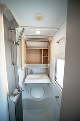 ANKARA,TR-AUGUST 20,2024:Interior with,tables,refrigerator,kitchen corners,ceiling ligthning,couches,living space in modern Adria Alpina 583 LP.