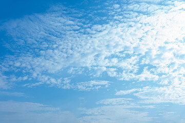 Bright Blue Sky with Scattered Cumulus Clouds Natural Background Texture