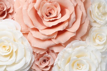 Beautiful paper flowers as background, top view