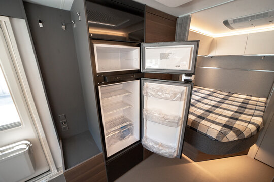 ANKARA,TR-AUGUST 20,2024:Interior with,tables,refrigerator,kitchen corners,ceiling ligthning,couches,living space in modern Adria Alpina 583 LP.