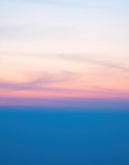 Obraz premium Soft blue twilight sky merging with warm sunset hues, ethereal and peaceful, peaceful sky, glow, heaven