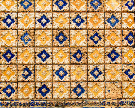 Part of a wall covered with Portuguese tiles in blue, yellow and white relief, in the historic center of the city of São Luís, Maranhão, Brazil