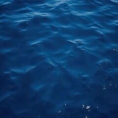 Fototapeta premium Deep, rich indigo water with subtle texture and shifting light, turquoise, ripple, sunlight