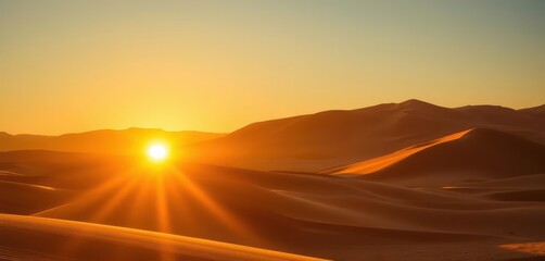 Obraz premium Golden sun dips below dramatic desert dunes, casting long shadows, empty, untouched landscape, peaceful