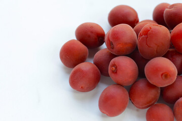 Umeboshi, Japanese pickled plums, Sour and salty taste.