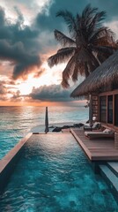 Fototapeta premium Serene beachfront villa with infinity pool under a dramatic sunset sky