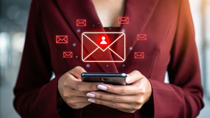 Business time notify. Woman in a burgundy blazer uses smartphone, glowing red email notification with person icon hovers above device. Blurred