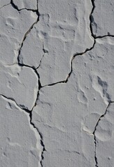 Obraz premium Rough, uneven gray stone surface with visible texture and crevices, rock, gray, hard